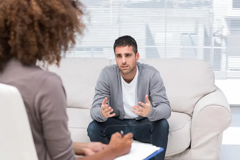 man talking to his therapist about mental health and addiction