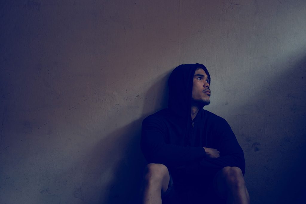 Individual struggling with the effects of America’s heroin crisis