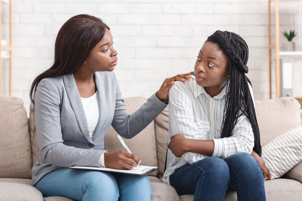 supportive therapist guiding her patient in Suboxone addiction recovery