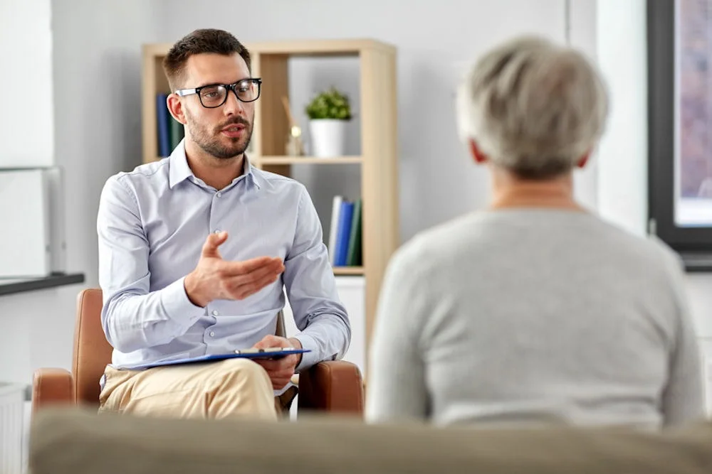 a therapist talking to a patient