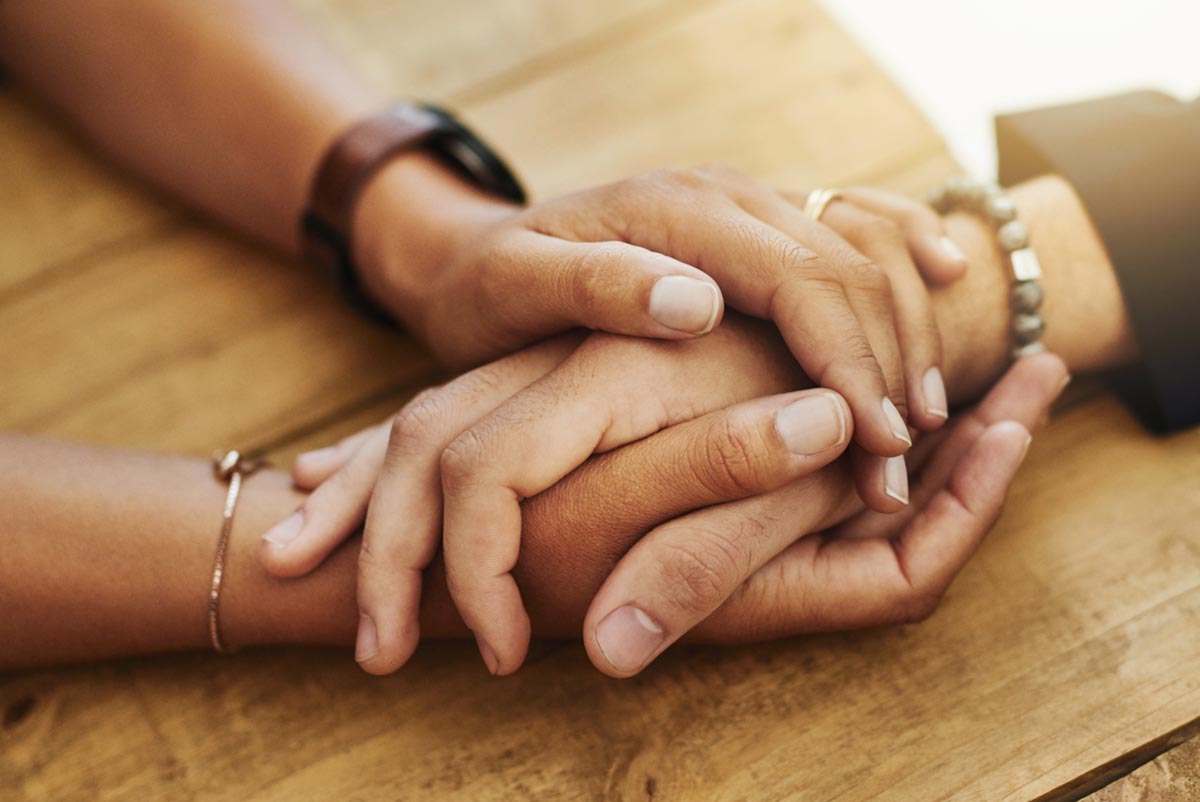 A person helping another in codeine addiction treatment
