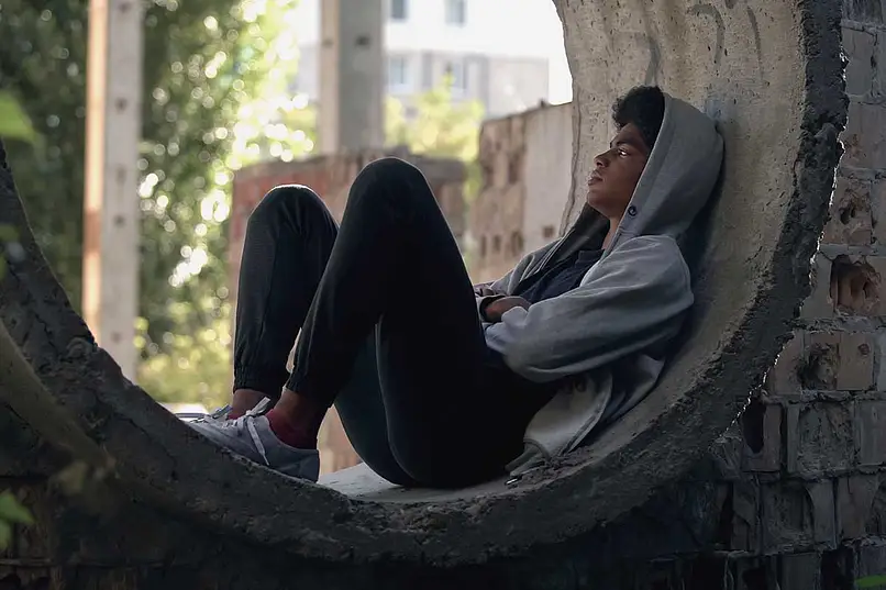 a man with mental health problem sitting alone