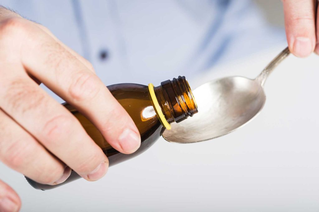 A person addicted to cough syrup