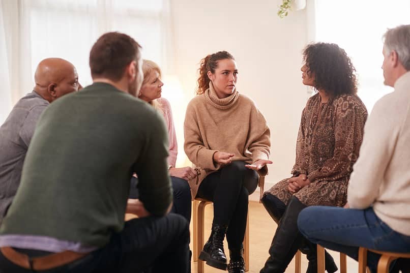 woman sharing in aa group meeting