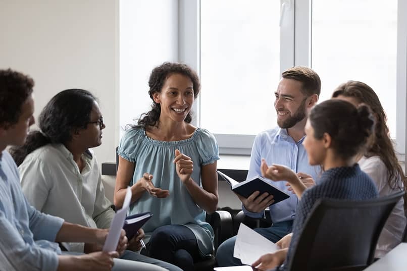 a group of patients sitting in circle during therapy