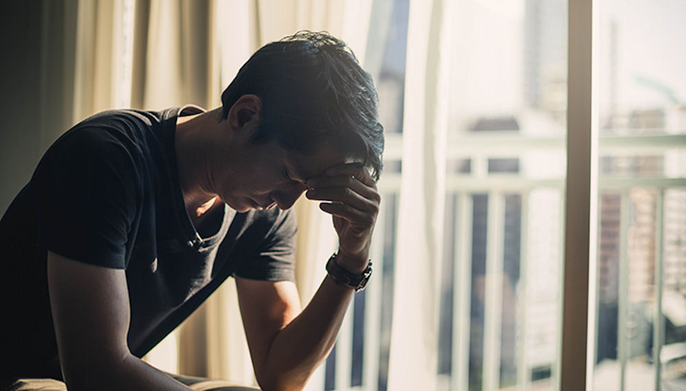 man with headache has psychological dependence