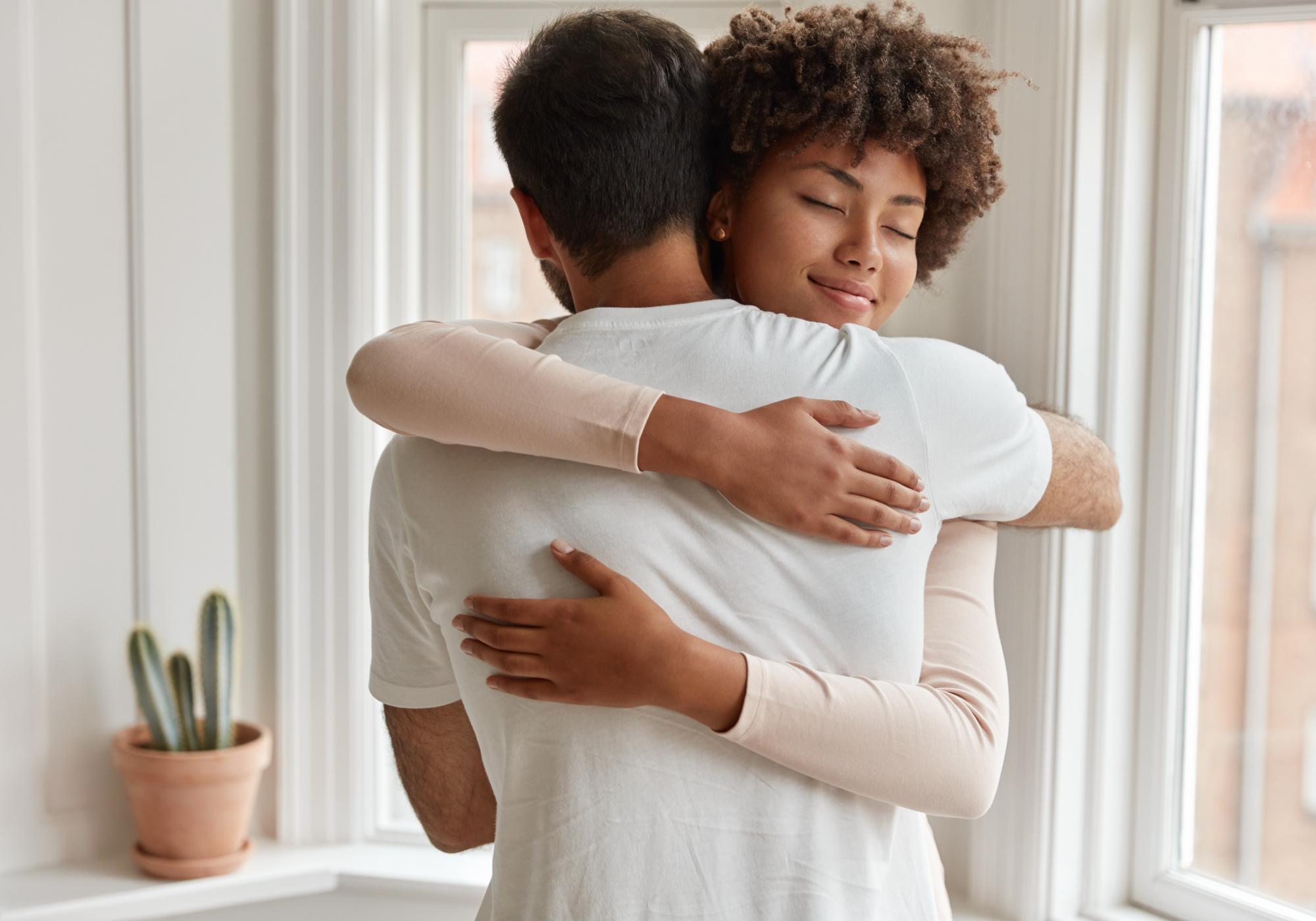 a couple hugging in therapy