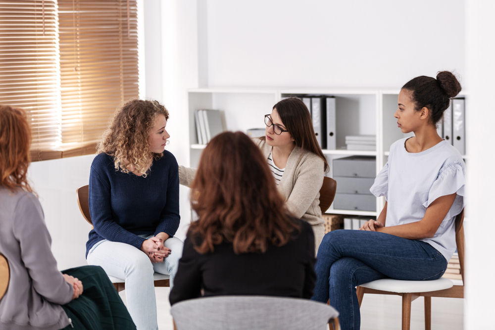 women in group therapy for addiction