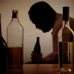 an-older-man-surrounded-by-alcohol