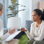 a woman with postpartum depression in therapy