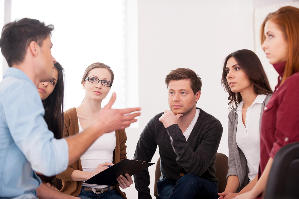 A group sharing experiences during Extended Care Addiction Treatment