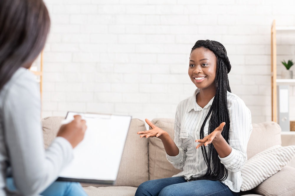 a woman smiling in therapy