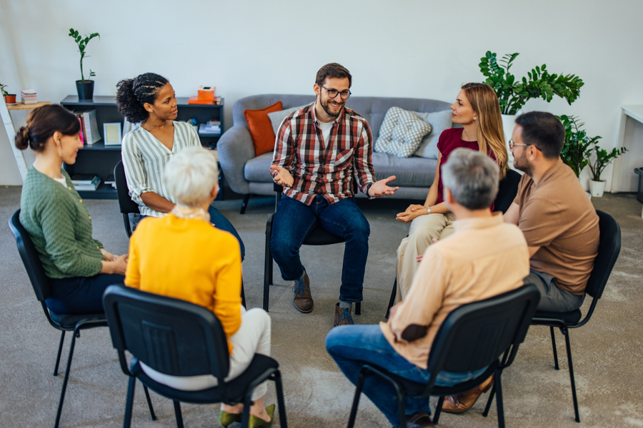 Individuals practicing life skills in rehab therapy