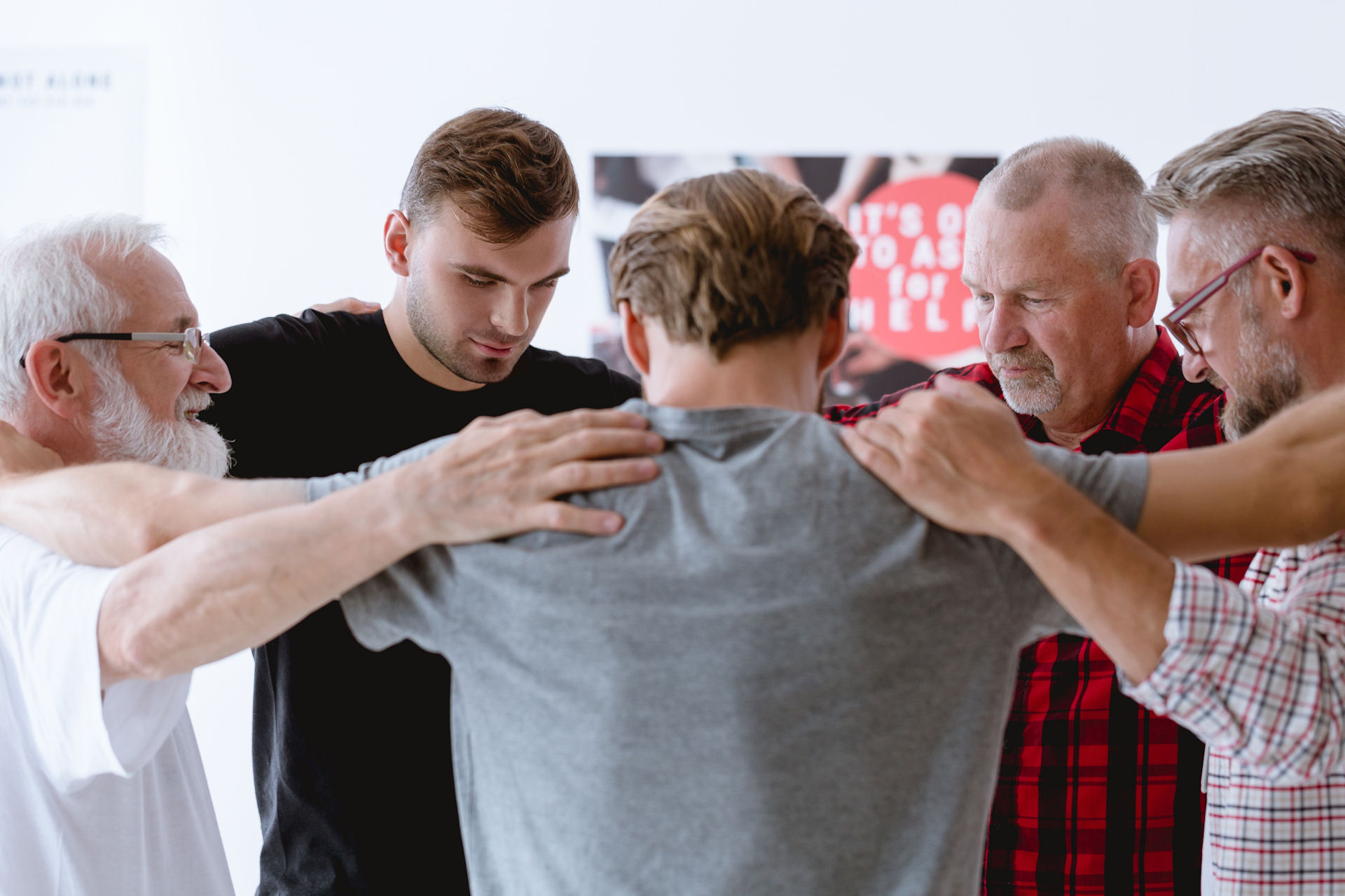 Group therapy session for men in addiction recovery