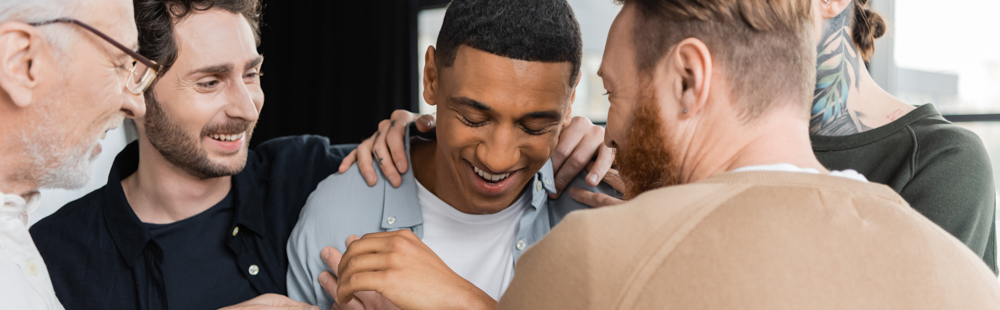 a-man-being-hugged-in-therapy