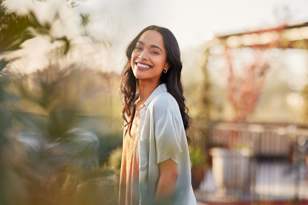 A smiling woman who has decided to enter LGBTQ+ rehab
