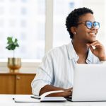 a man staring away on computer