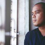 a man staring at window