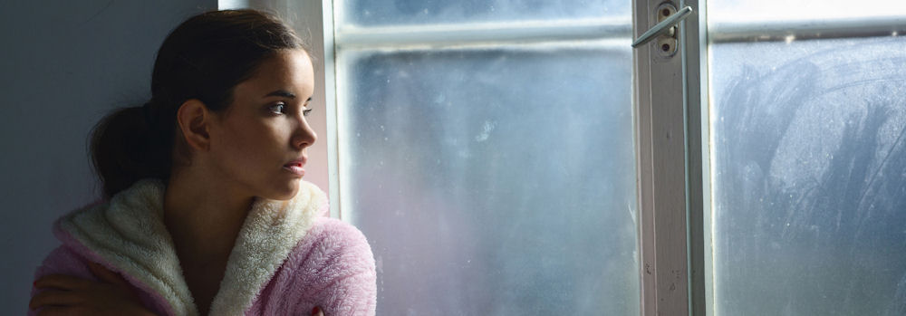 a-woman-staring-out-the-window