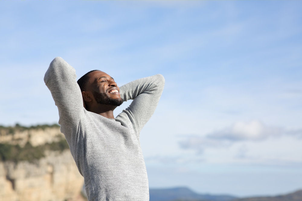 a-man-smiling-out-in-nature