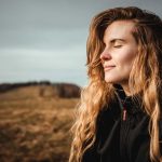a woman outside enjoying nature