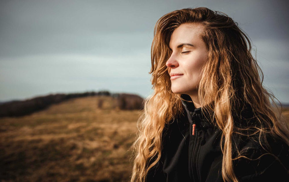 a woman outside enjoying nature