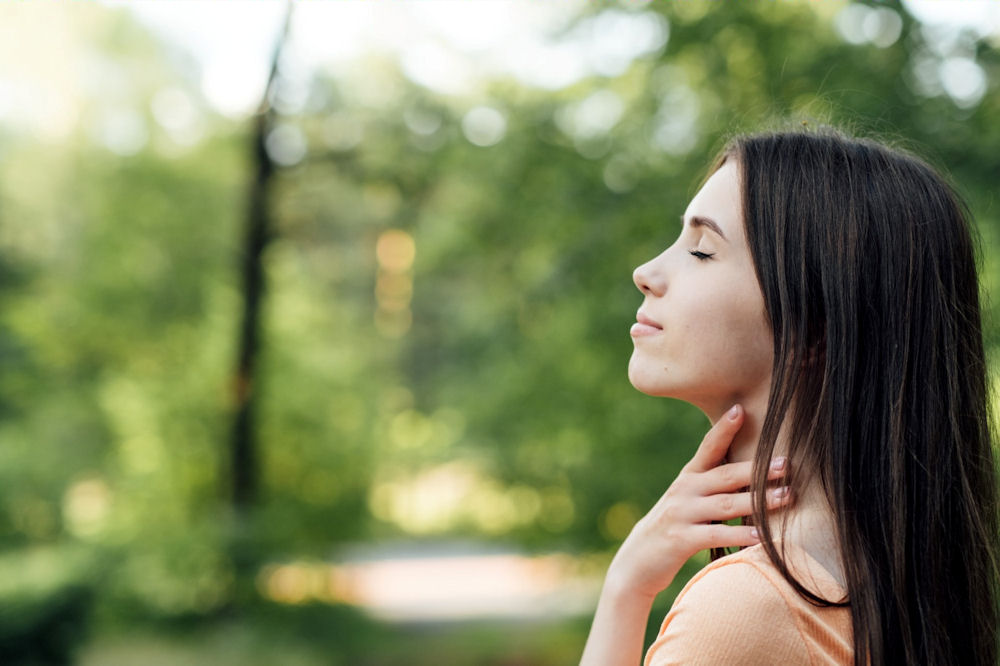 a-woman-with-her-eyes-closed-meditating