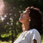 a-woman-with-eyes-closed-in-nature