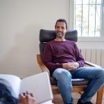 a-man-smiling-in-therapy