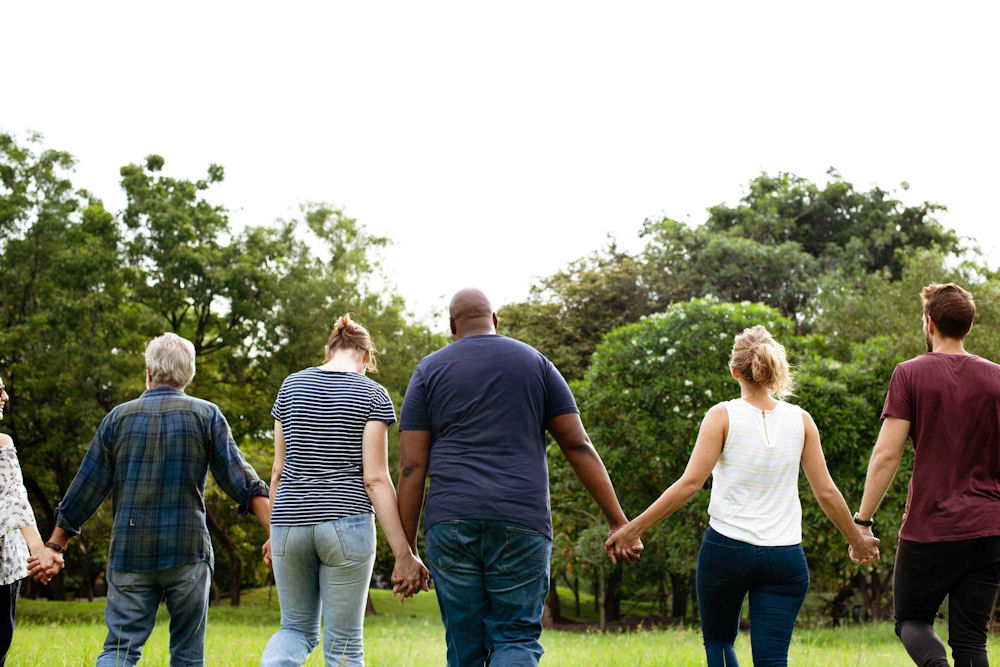a-group-of-individuals-holding-hands