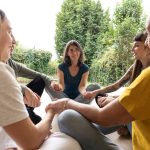 a-group-of-women-sitting-in-a-circle