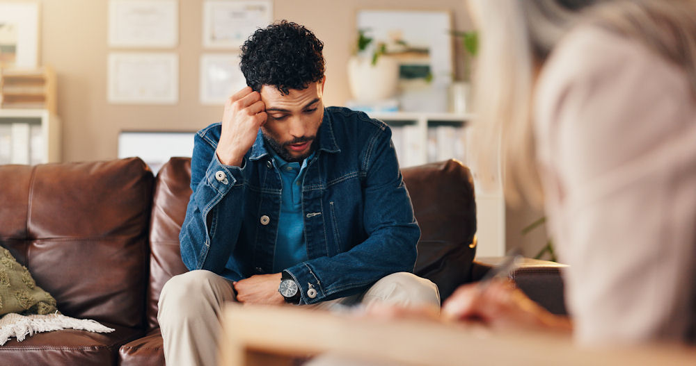 a man standing in therapy to work on sobriety