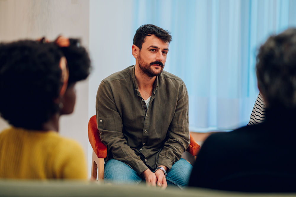man in group to work on sobriety