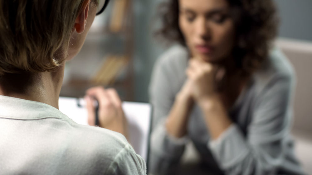 a woman in a therapy session for meth addiction